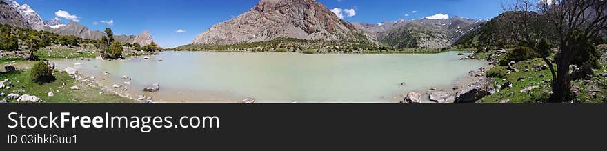 Mountain lake in background with high mountain