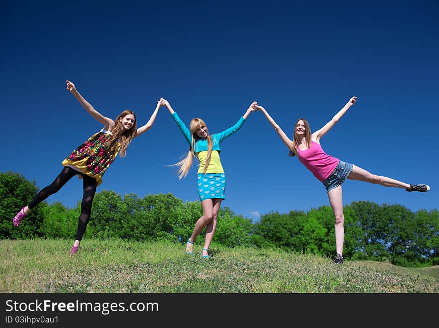 Group of young girls play and express positivity in park. Group of young girls play and express positivity in park