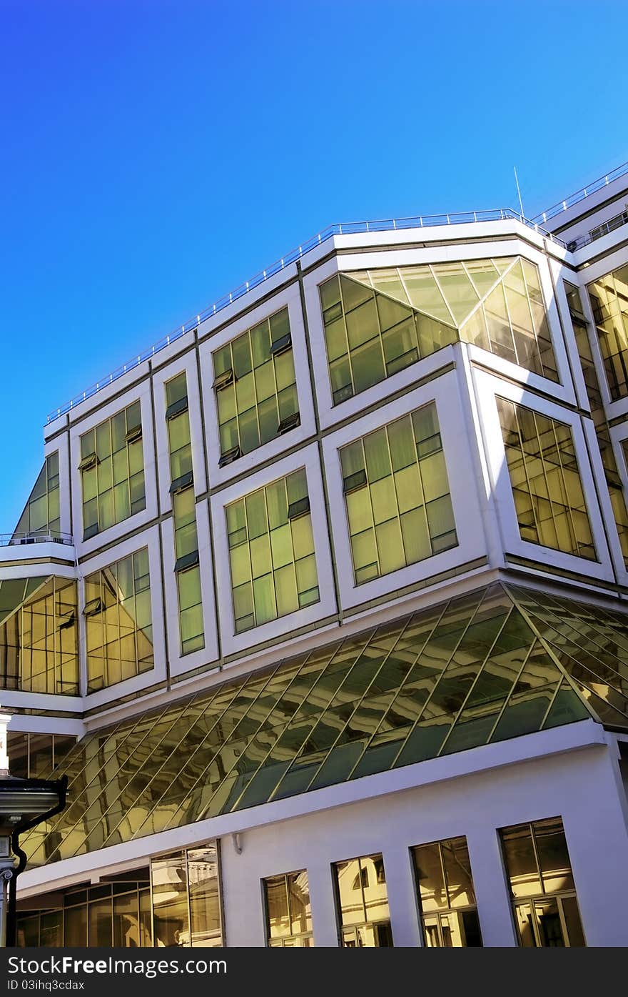 Picture of modern office building over blue sky