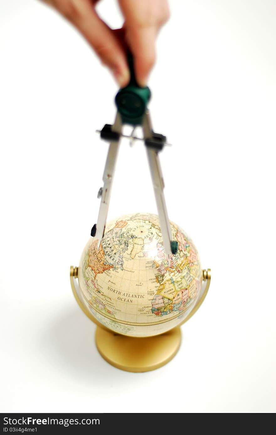 Studying the globe with a compass. Studying the globe with a compass