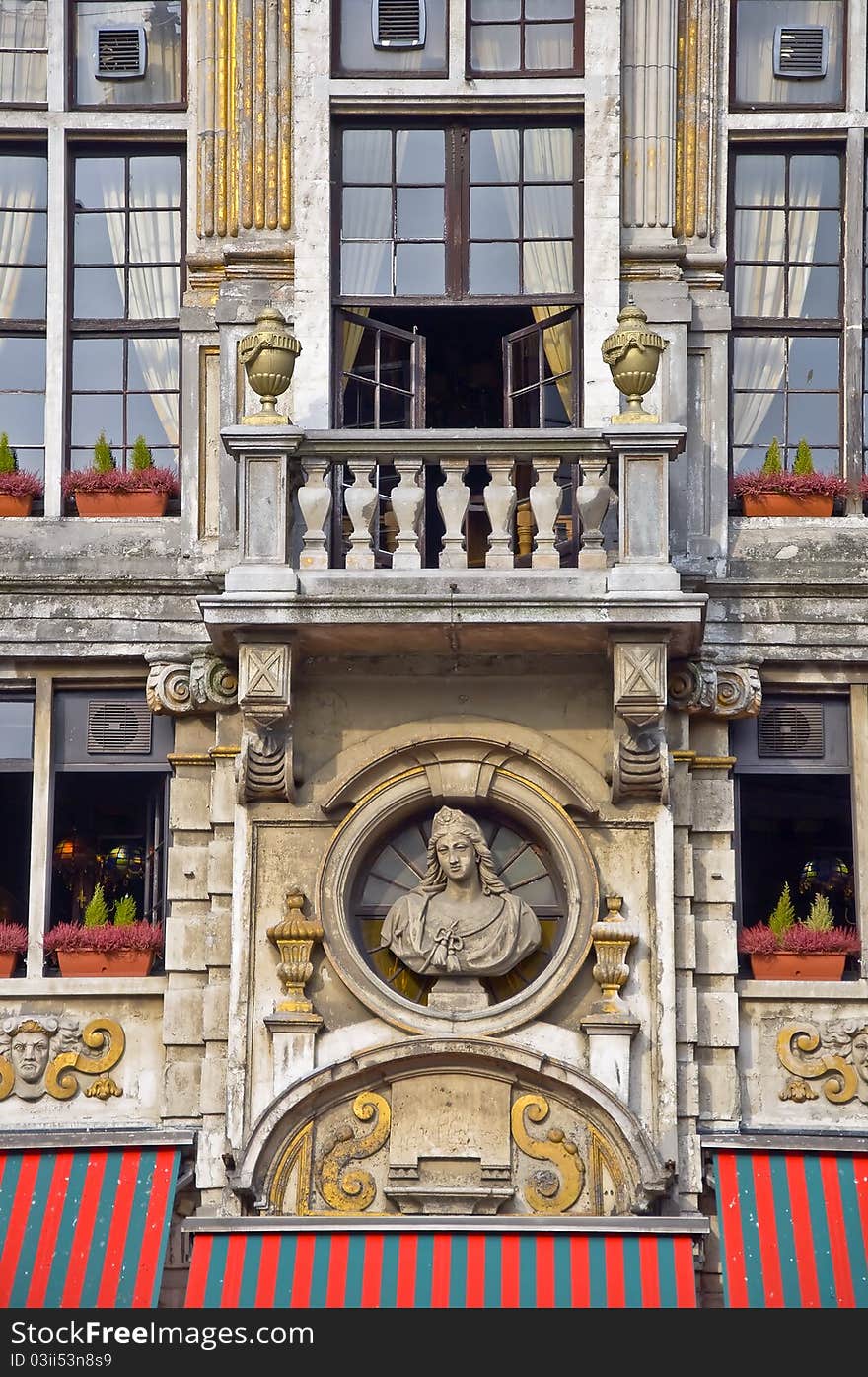 Balcony with a statue and vases. Brussels. Fragment.