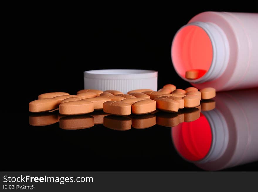 Pill bottle with orange pills