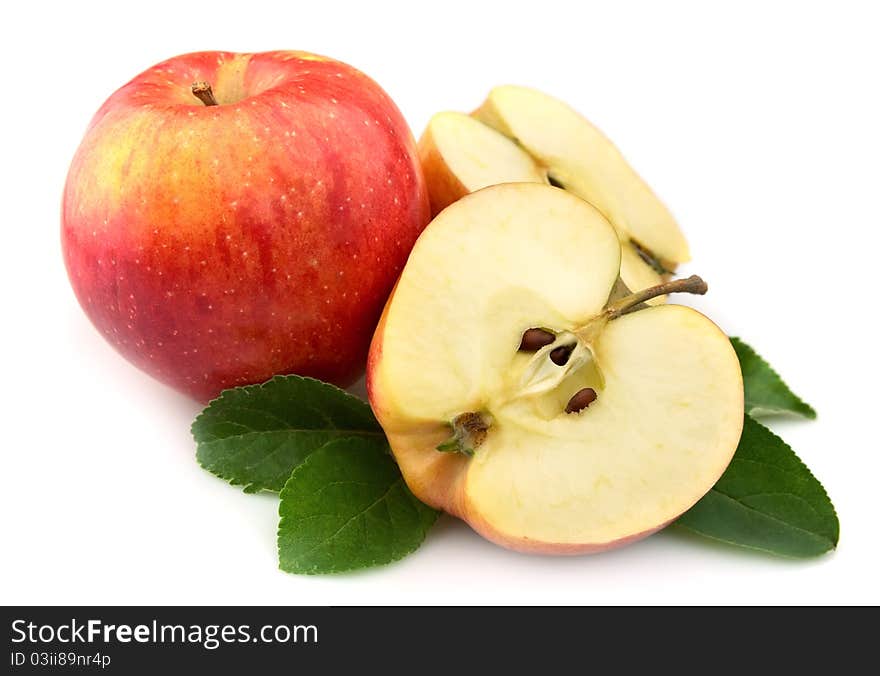 Juicy red apples with leaves on a white background