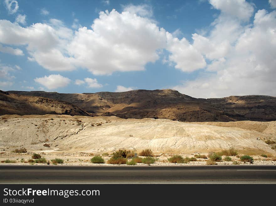 Stone desert and mountains along the road