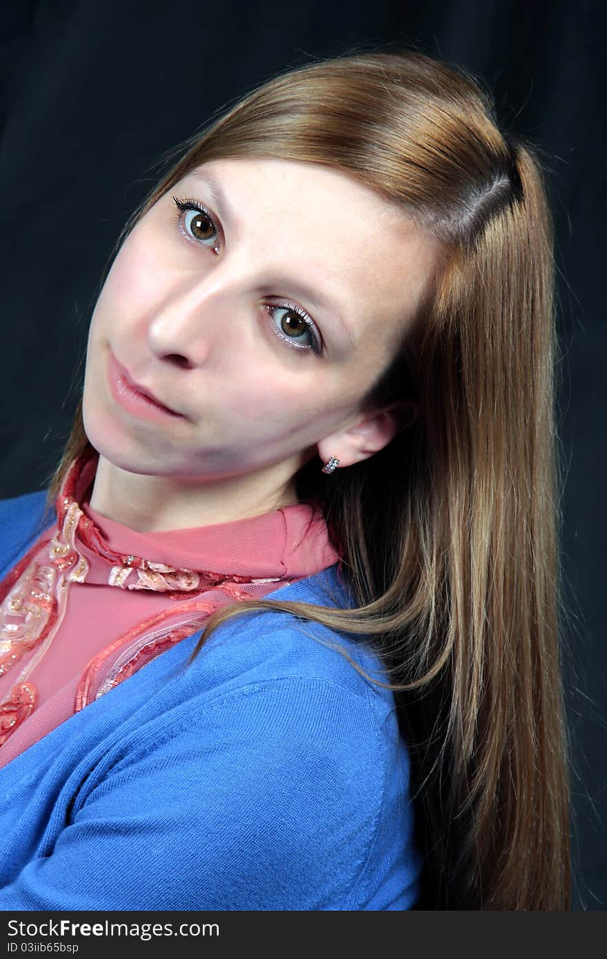 Portrait of the girl on a black background