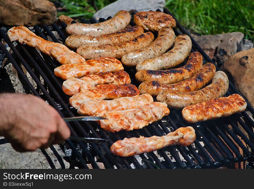 A delicious meat cooking on the grill. A delicious meat cooking on the grill