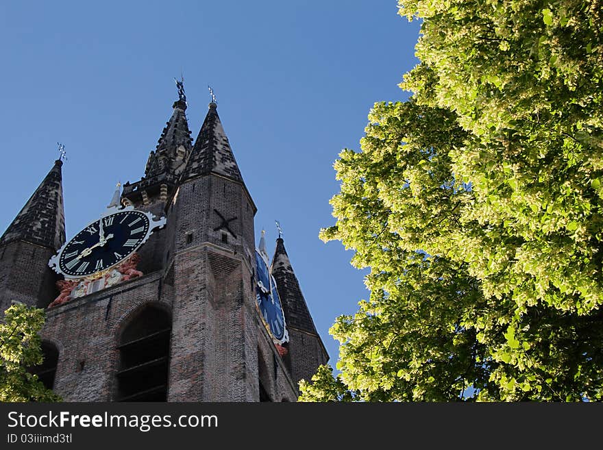 It shows the tower of the Old Churck of the city of Delft in the Netherlands. It shows the tower of the Old Churck of the city of Delft in the Netherlands