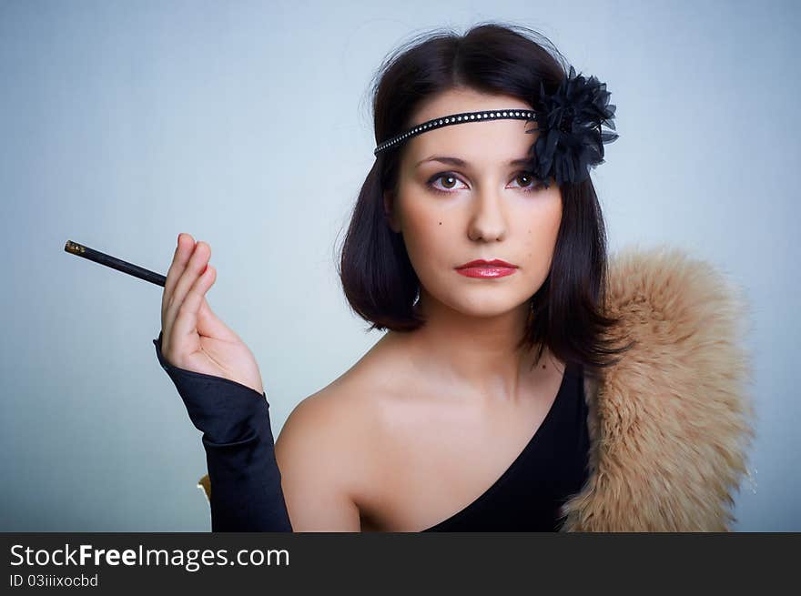 Retro portrait of a young woman in studio