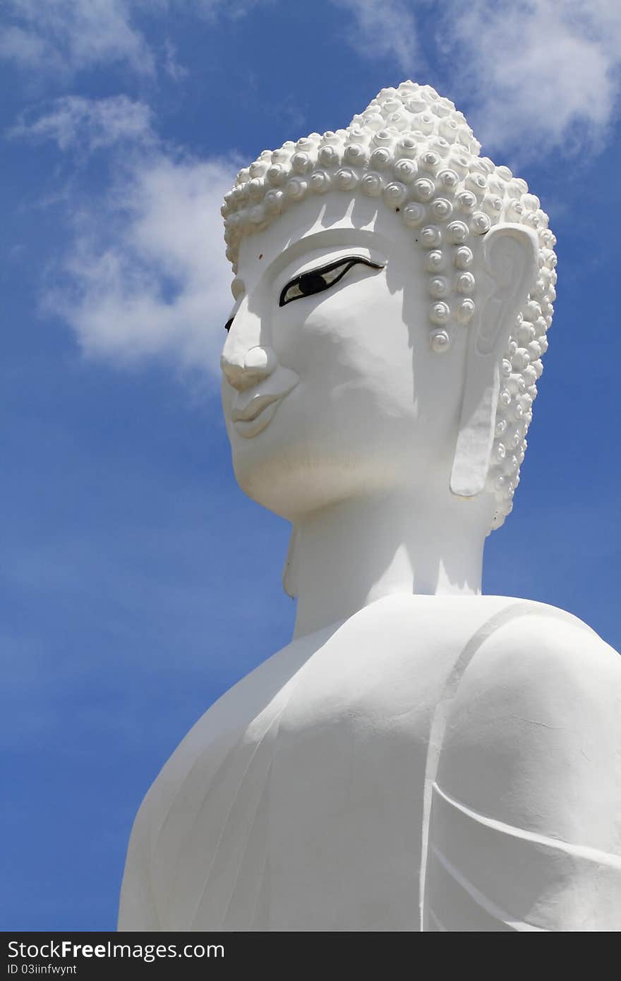 A statue of of a white Buddha in Thailand