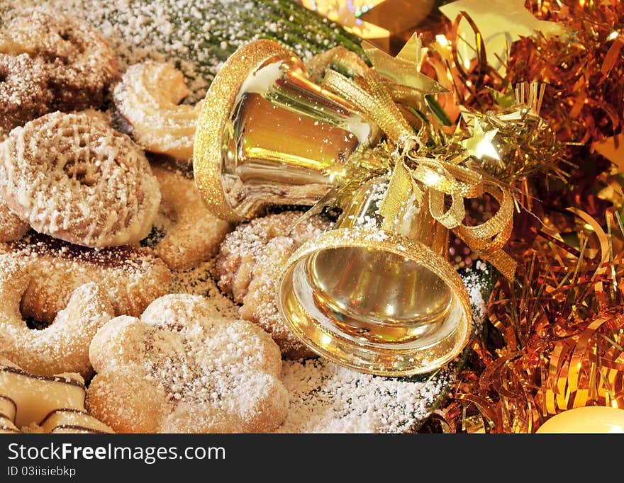 Christmas still life photo with cookies and golden bells. Christmas still life photo with cookies and golden bells