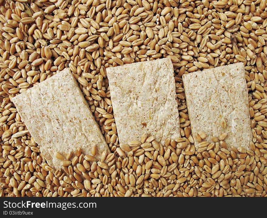 Small loaf (of bread), bread crisps and grains of wheat