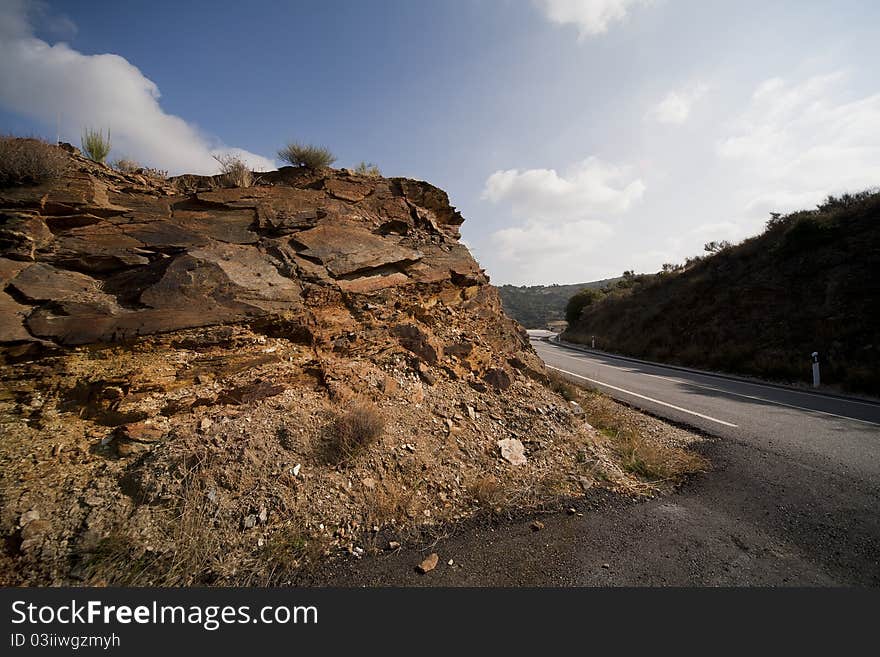 Rocks along the asphalt road