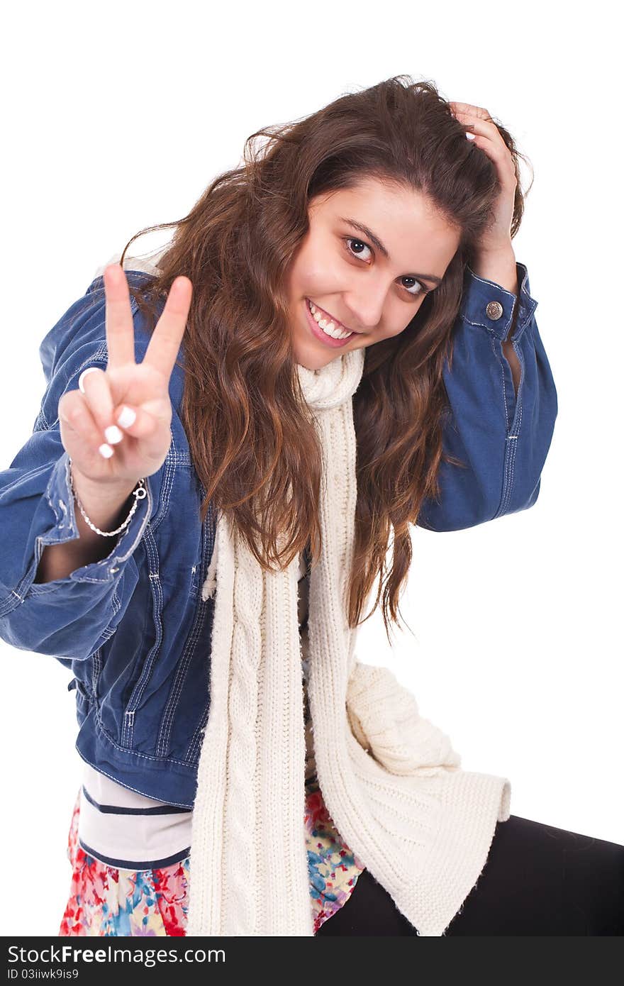 Young and beautiful woman doing the victory sign with her fingers