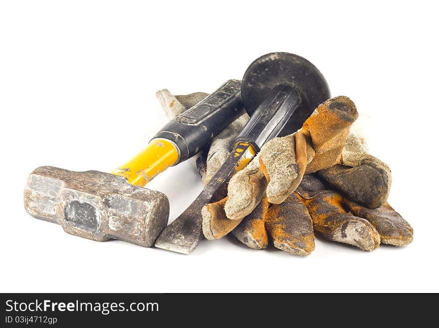 Dirty old leather glovesand heavy duty tool isolated on white background