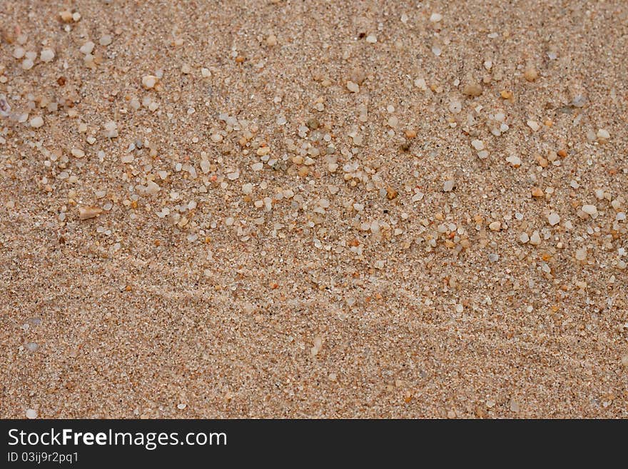 White pebble and brown sand on beach. White pebble and brown sand on beach