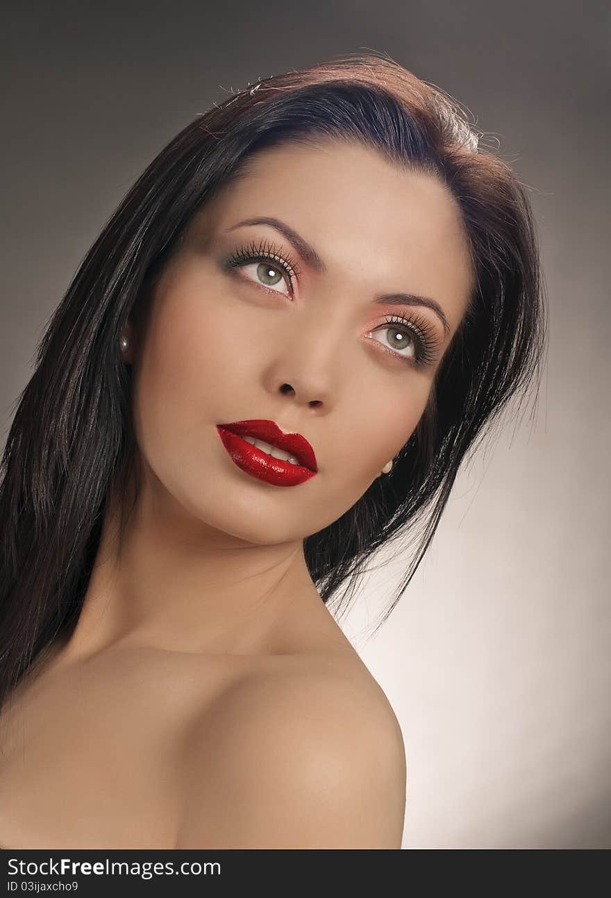 Portrait of beautiful brunette girl with beautiful red lips. Portrait of beautiful brunette girl with beautiful red lips