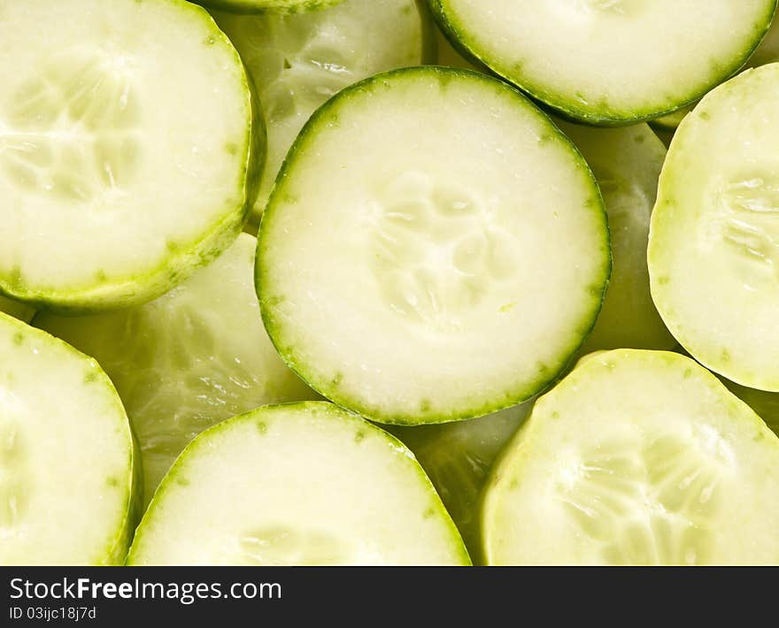 Cucumber slices layered in rows, overhead shot