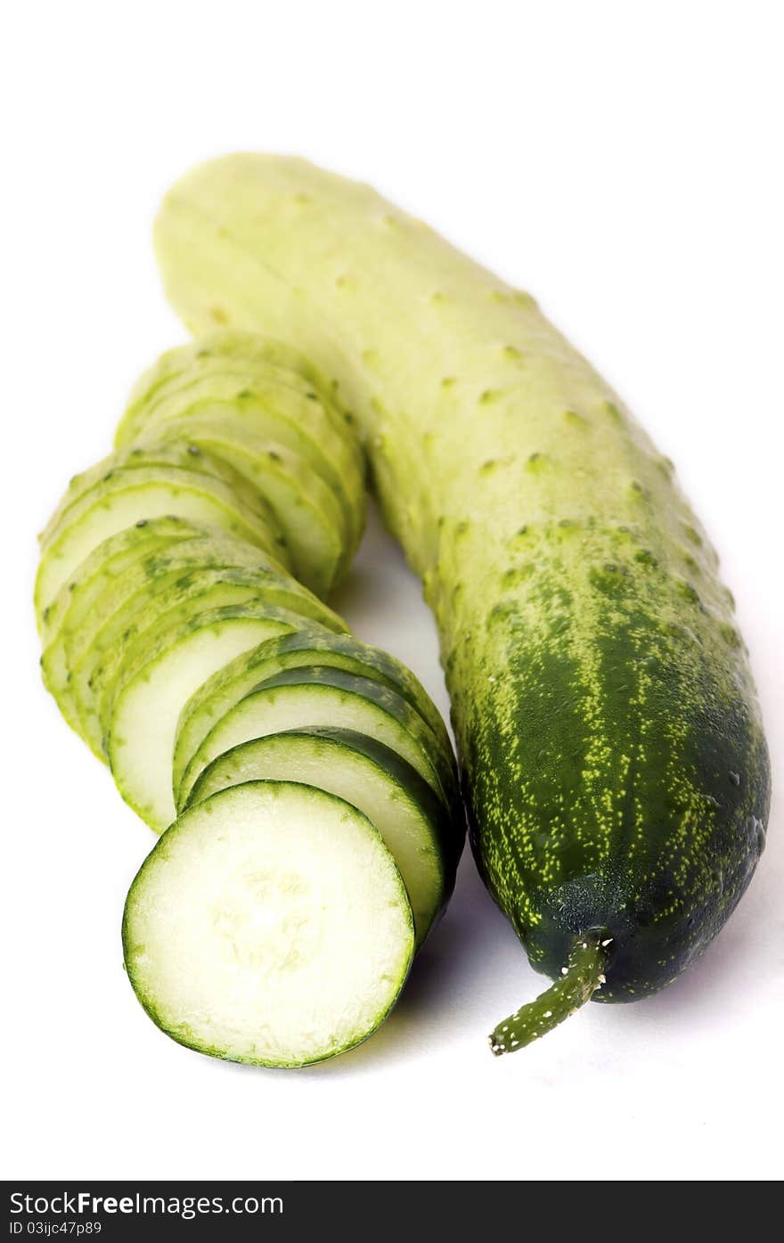 Two Cucumbers, One Whole And One Sliced