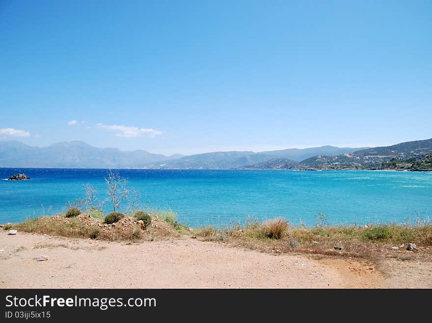 Cretan   light-blue sea  near city Agios Nikolaos. Cretan   light-blue sea  near city Agios Nikolaos