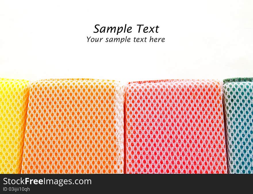 Colorful sponges isolated with copy space