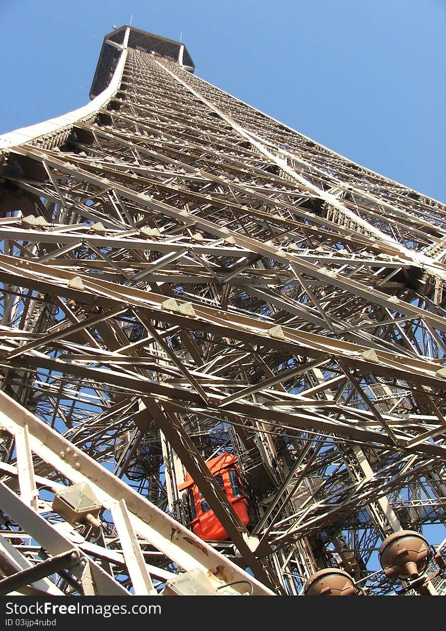 Looking up at the framework of the Eiffel tower