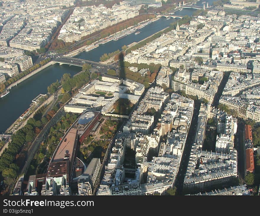 Shadow of eiffel tower overlooking the river seine and paris. Shadow of eiffel tower overlooking the river seine and paris