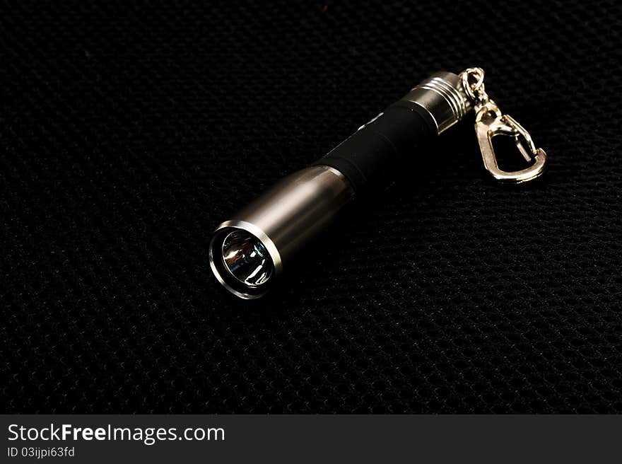 Flashlight light against a dark background