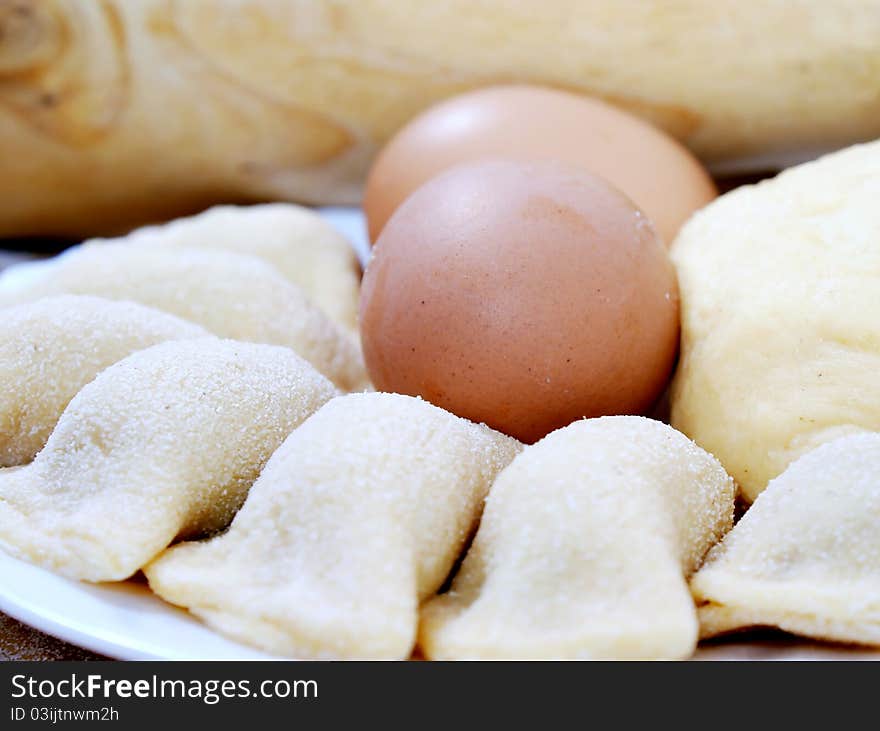 Eggs and meatballs in dough