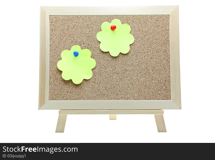 Two flower shape memo paper on cork board on white background. Two flower shape memo paper on cork board on white background