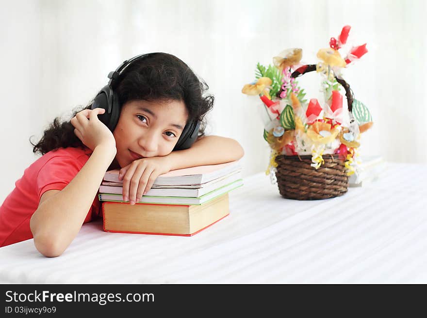 Young asian student listening to music. Young asian student listening to music