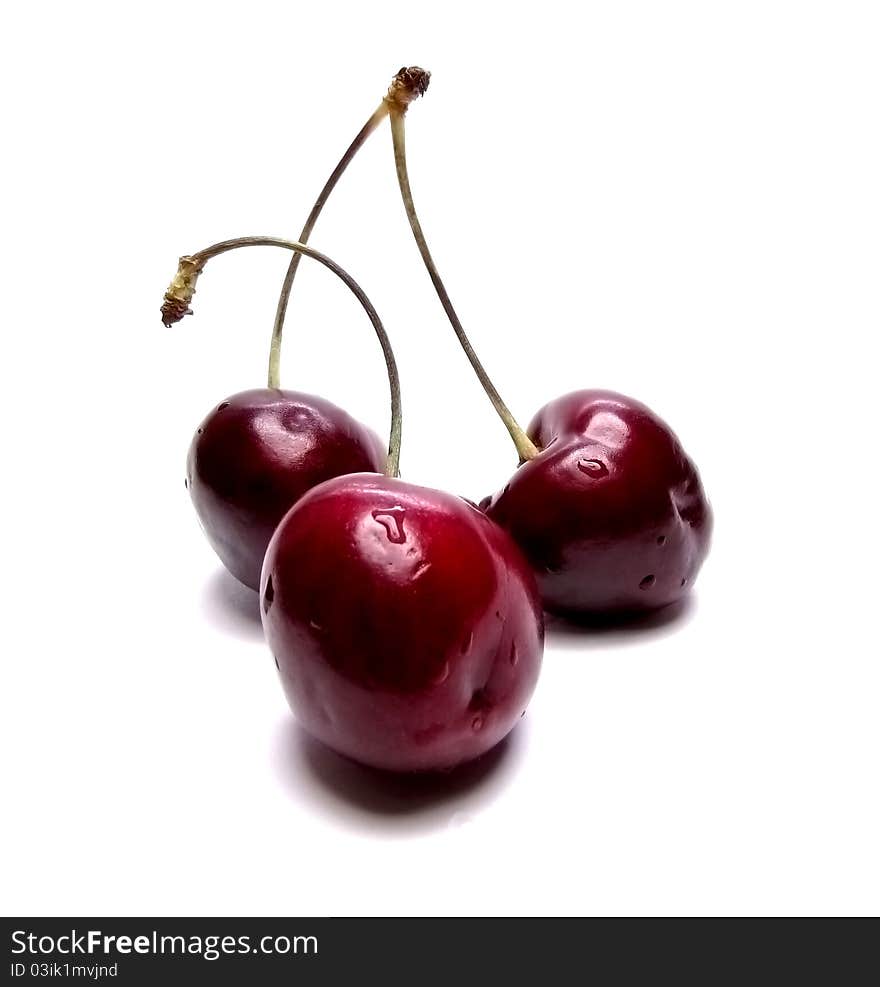 Three cherries on a white background. Three cherries on a white background