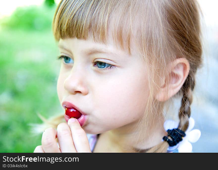 Nice Girl In The Garden With Cherry