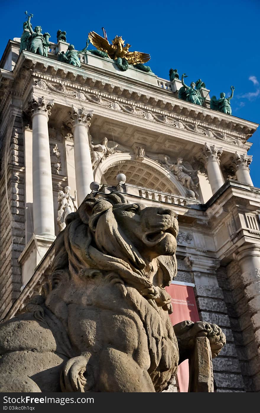 Stone lion sculpture guarding vienna's national library. Stone lion sculpture guarding vienna's national library