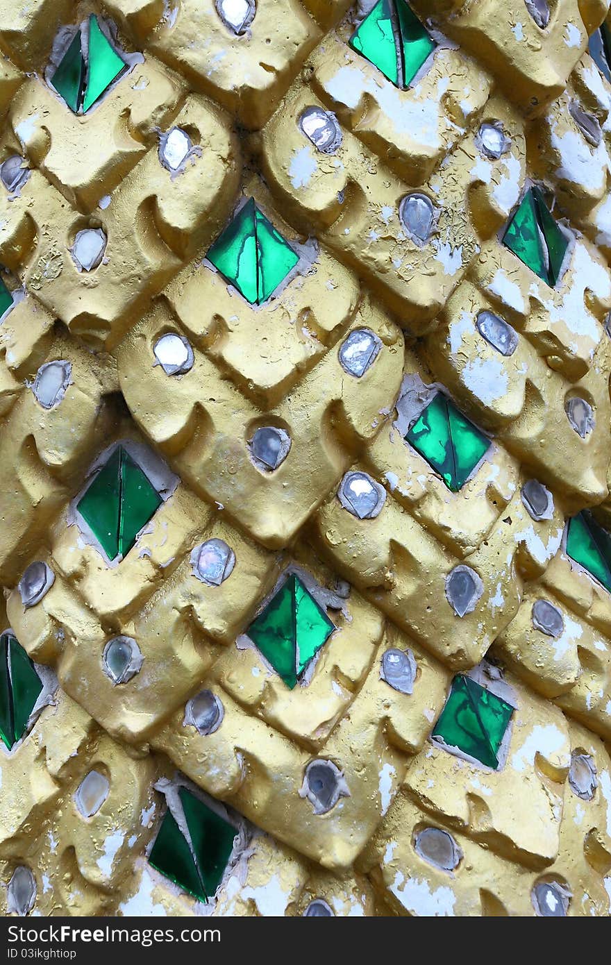 A stone carves the Thai painting in Thai temple