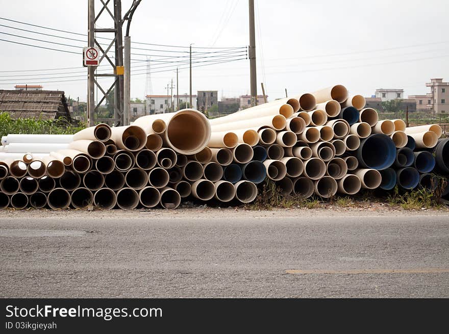 The pvc pipe beside the road.