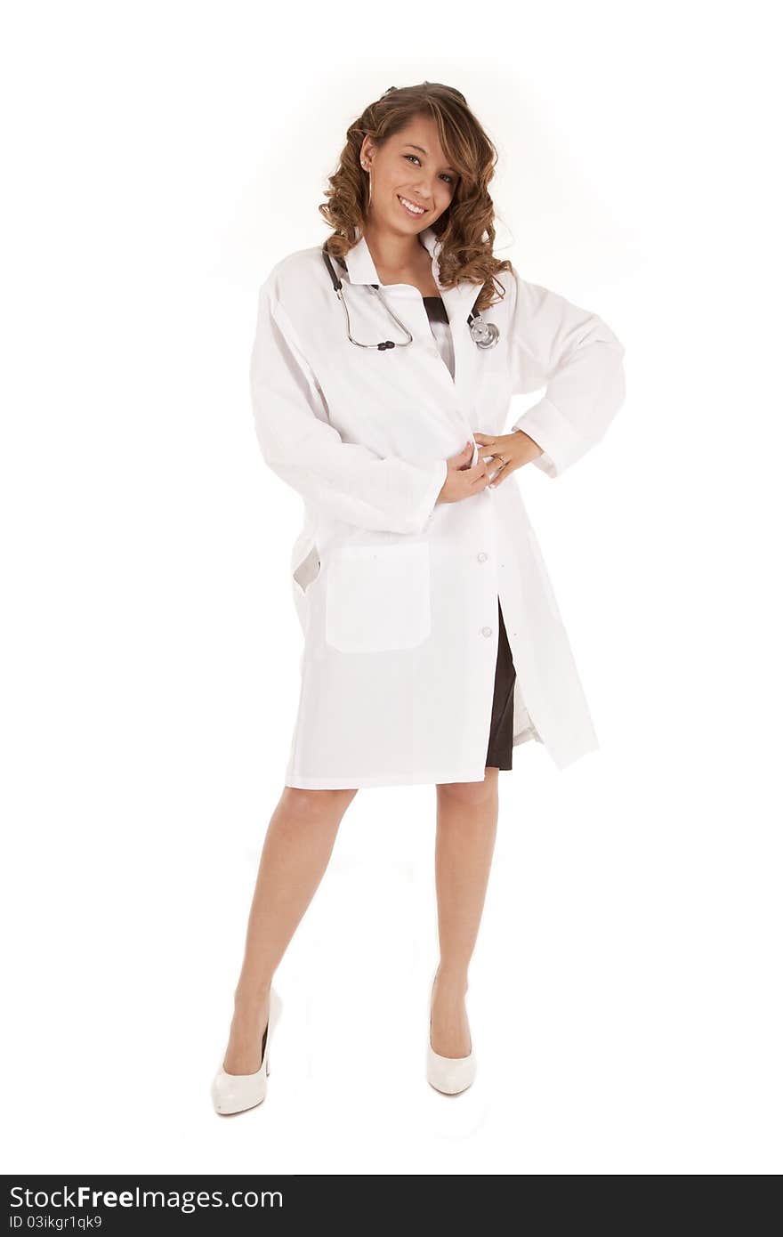 A woman doctor standing and posing in her lab coat. A woman doctor standing and posing in her lab coat.