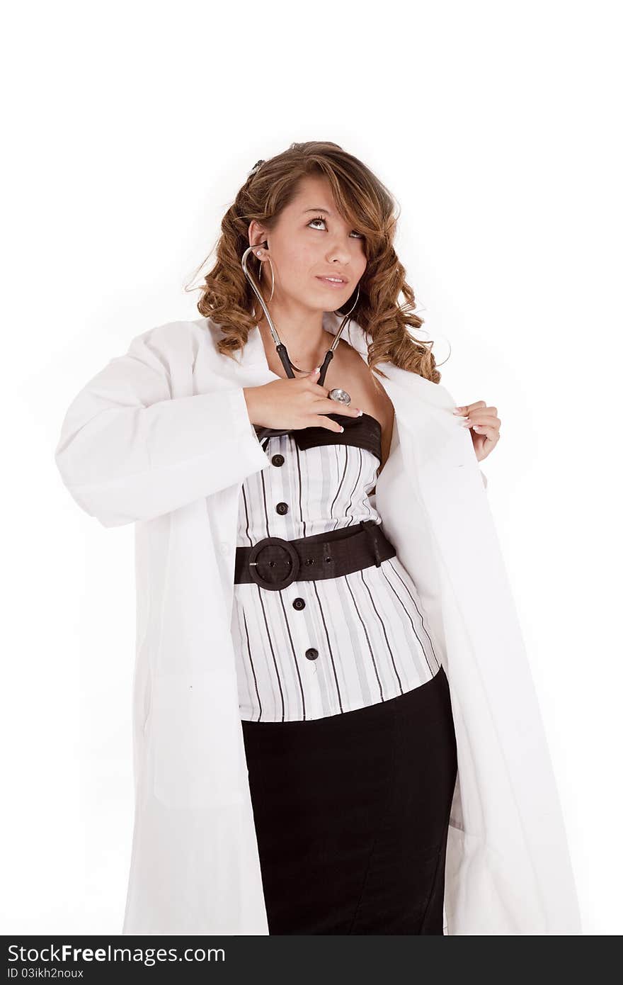 A woman doctor checking her heartbeat with her stethoscope. A woman doctor checking her heartbeat with her stethoscope.