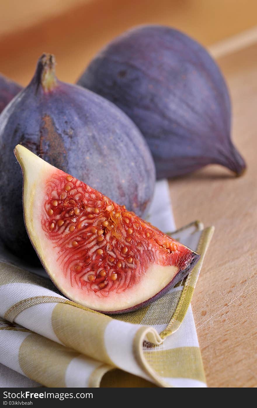 Slice fig on wood background. Slice fig on wood background