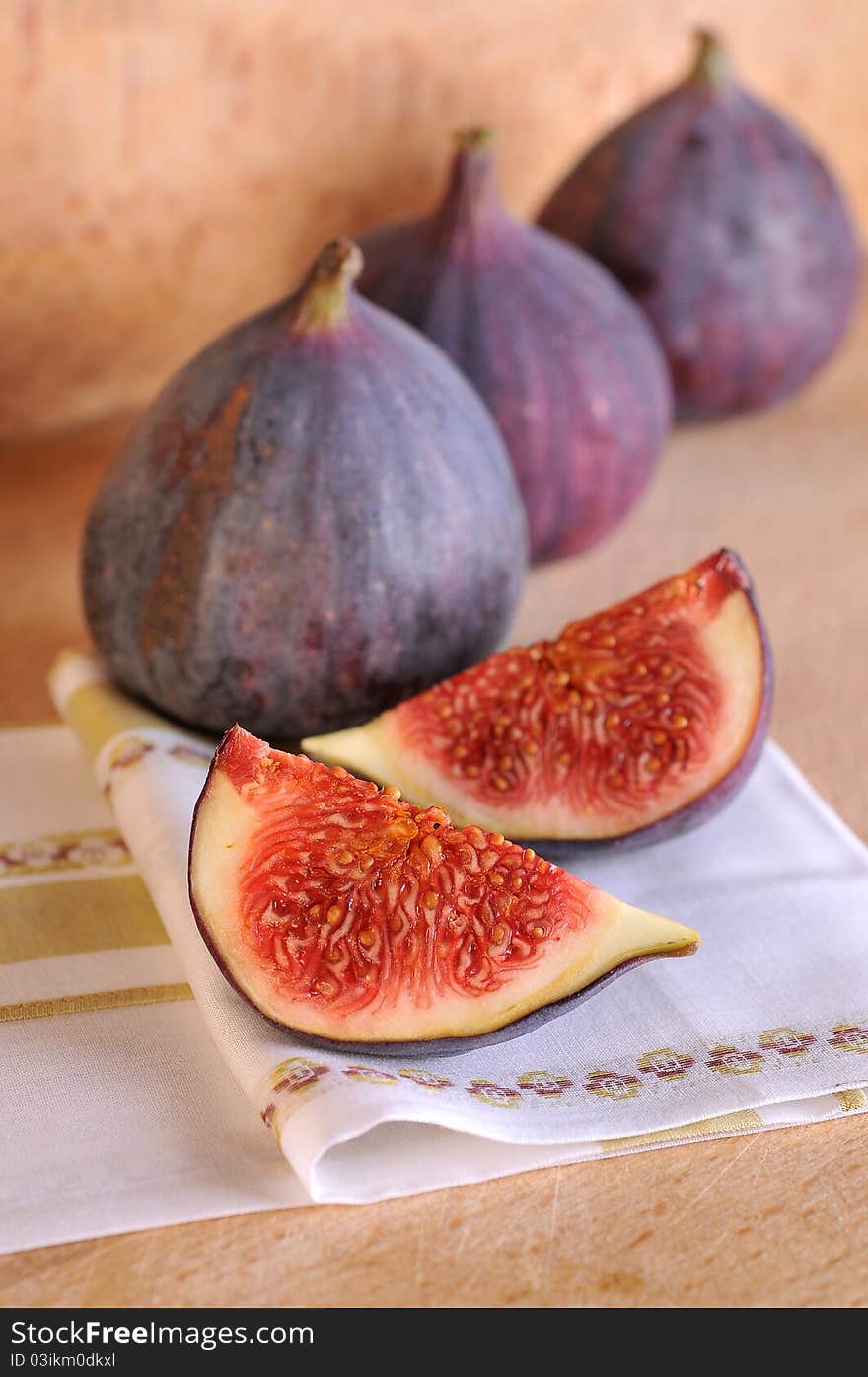 Slice fig on wood background. Slice fig on wood background