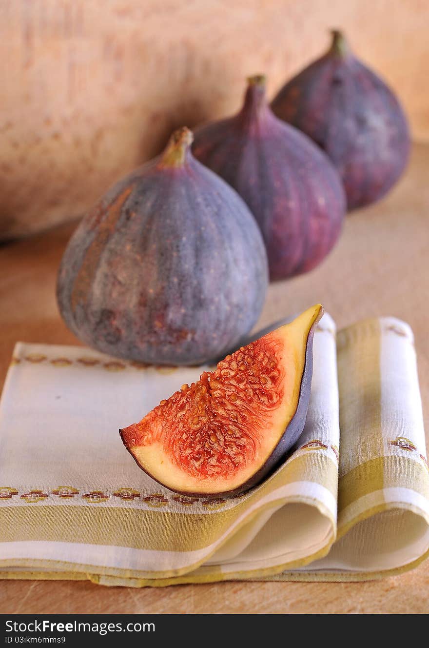 Slice fig on wood background. Slice fig on wood background