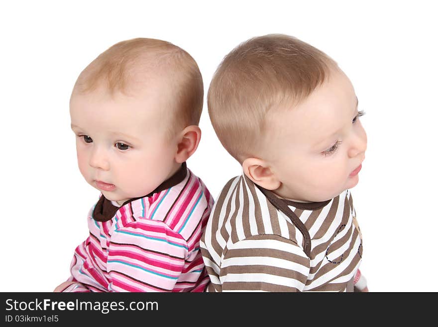 Baby boy and girl wearing striped clothing. Baby boy and girl wearing striped clothing