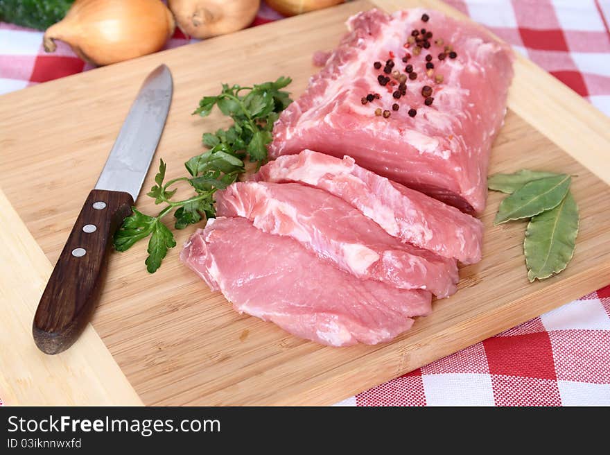 Pork chops on board to cutting