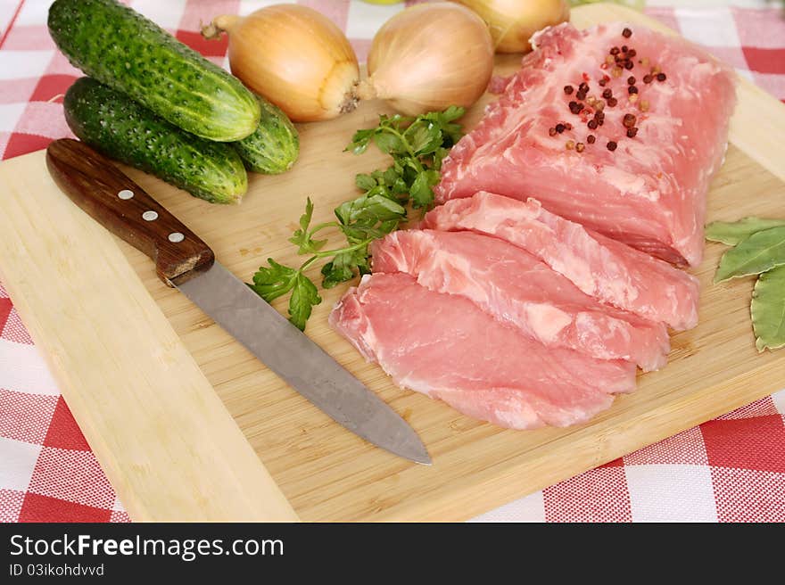 Pork chops on board to cutting