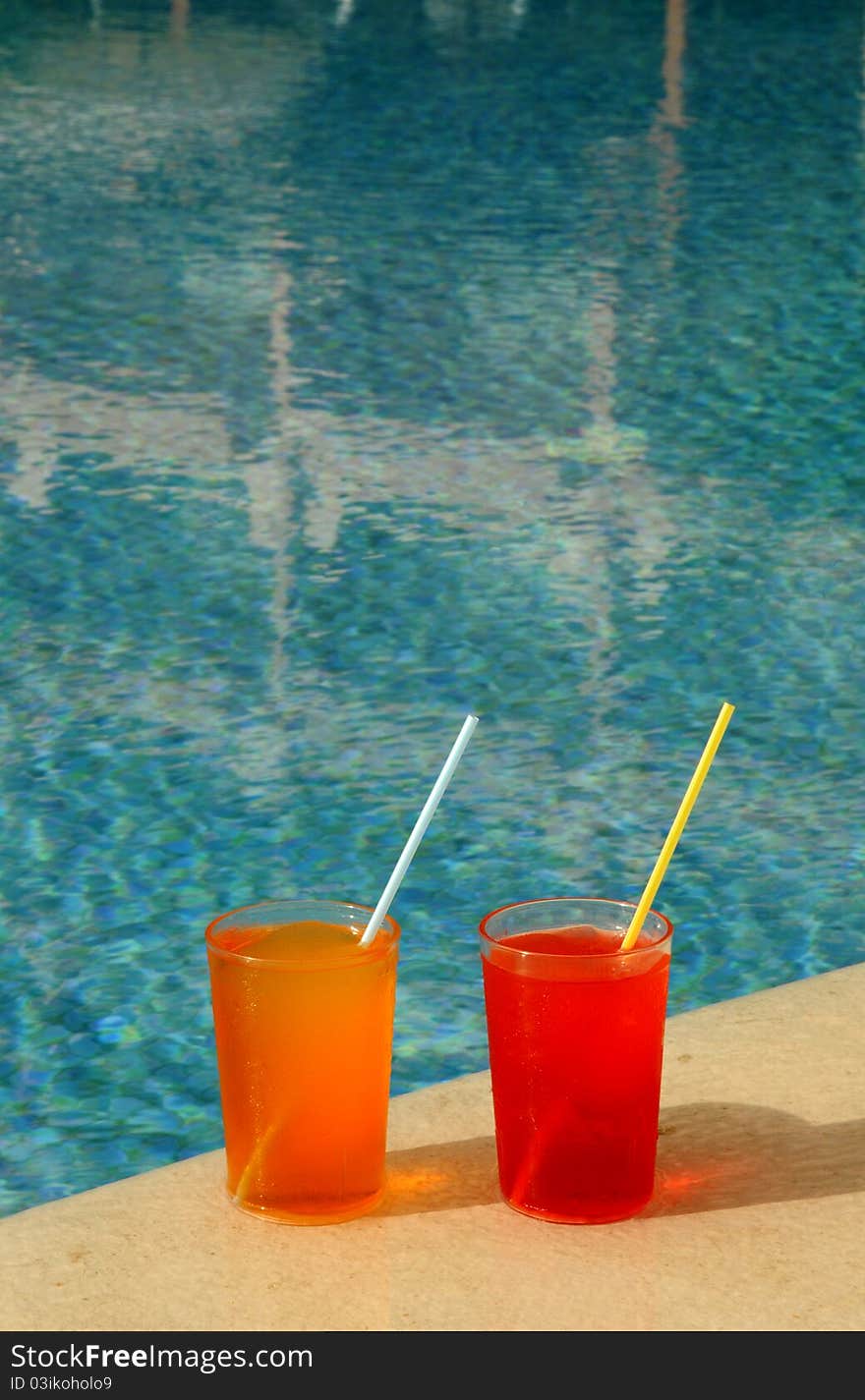 Drinking Glasses by a Swimming Pool. Drinking Glasses by a Swimming Pool