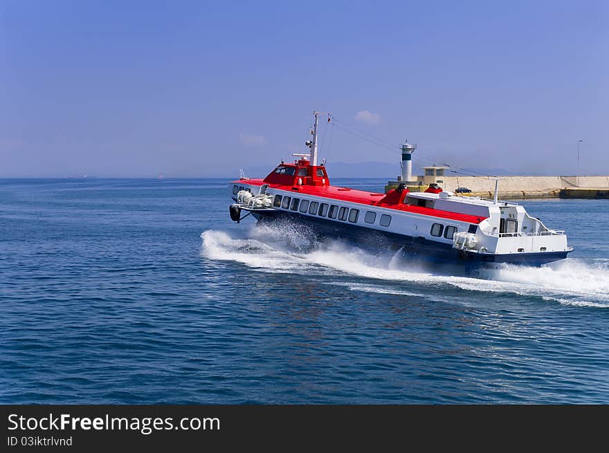 A Hispeed boat leaves the port of Piraeus. A Hispeed boat leaves the port of Piraeus