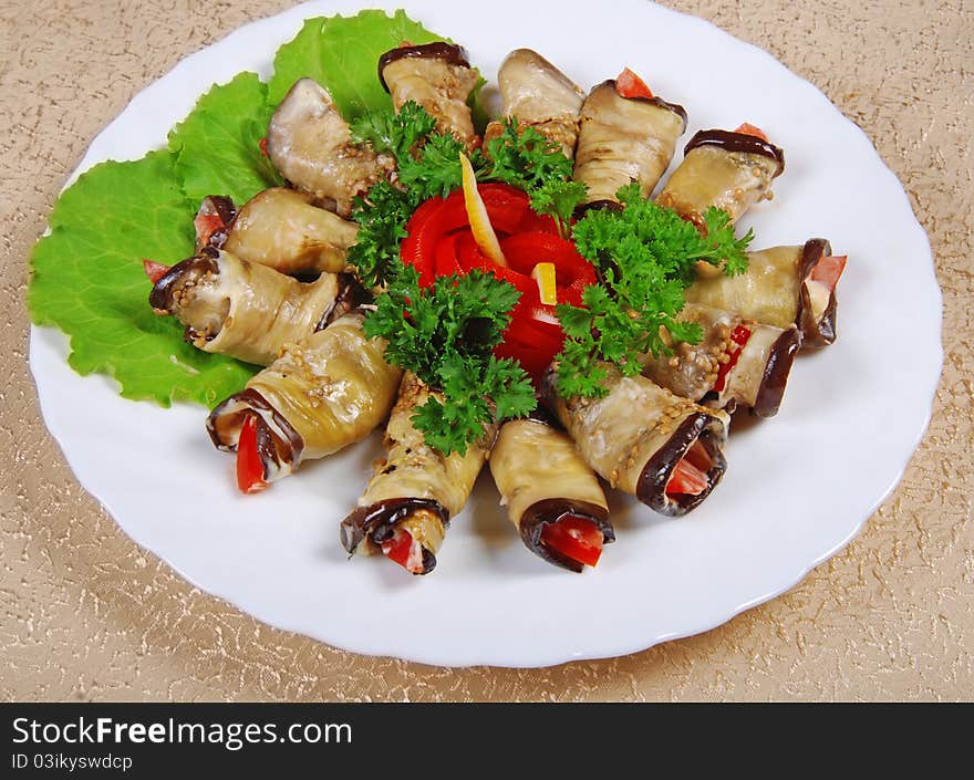 Egg-plant rolls on white plate. Egg-plant rolls on white plate