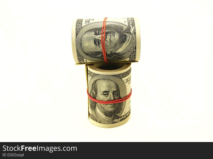 Rolls of money on a white background