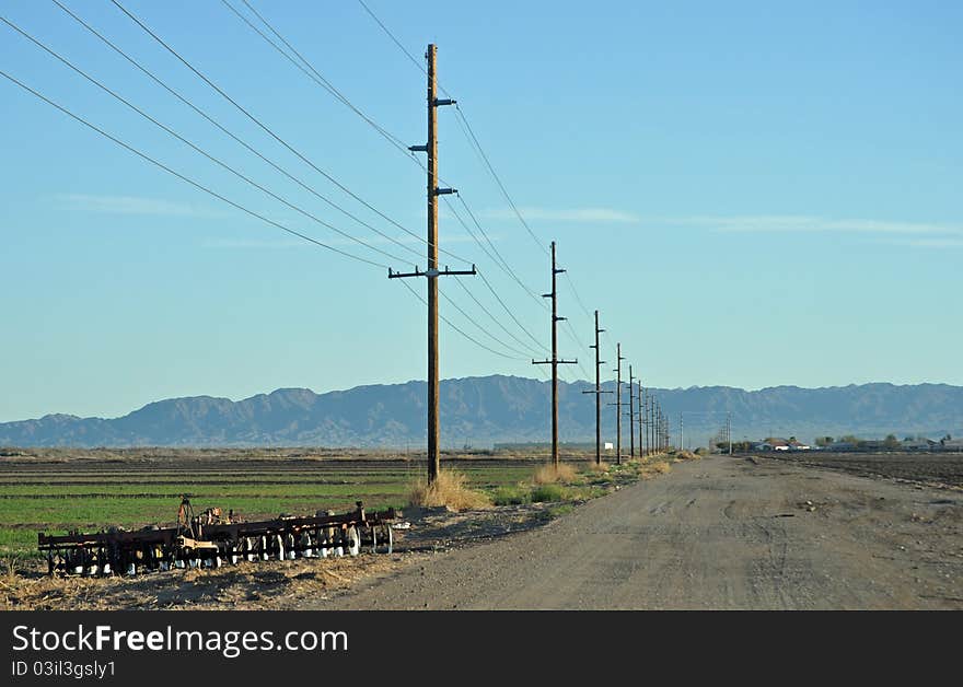 Disc plow beside field in Mohave Valley Arizona. Disc plow beside field in Mohave Valley Arizona.