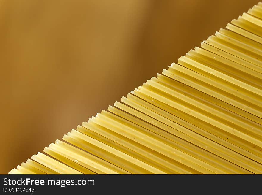 Uncooked spaghetti diagonal closeup detail