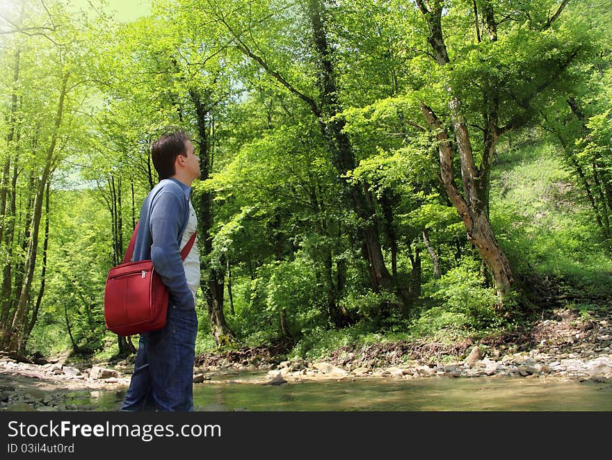 Man enjoying the fresh air in green forest. Man enjoying the fresh air in green forest